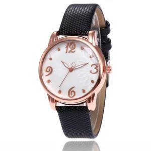 Close-up of floral dial watch with rose gold case and black snakeskin leather strap