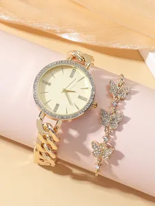 Elegant gold quartz watch set with rhinestones and matching butterfly bracelet on display