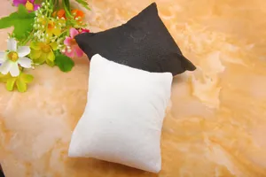 Detail of black and white velvet cushions for watch and bracelet jewelry presentation