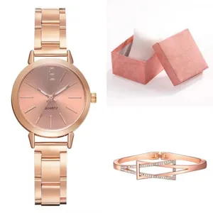 Women's rose gold quartz watch and geometric crystal bracelet set in a pink gift box