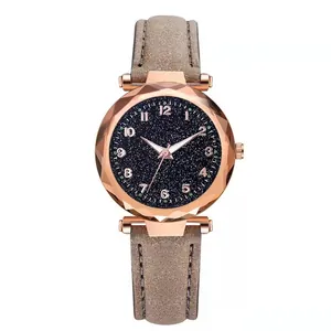 Detail of rose gold case with prism cut glass and starry blue dial quartz watch