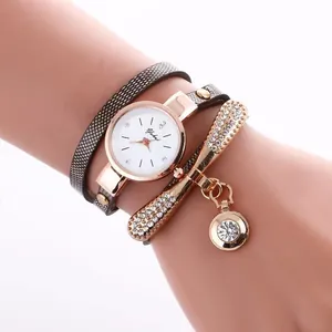 Detail of dragonfly wrap watch with rhinestone accents and rose gold hardware