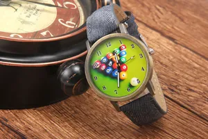 Close-up of billiard pool theme dial with vintage bronze case and blue denim strap