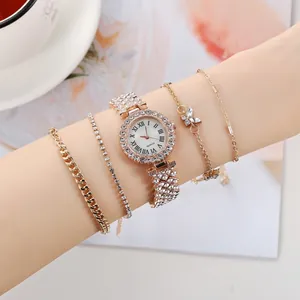 Luxury rose gold quartz watch set for women with rhinestone bracelets on a model's wrist