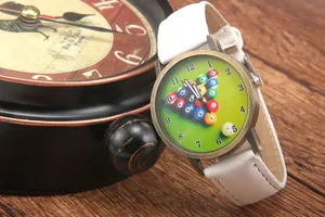 Detail of vintage bronze watch with green billiards dial and white leather strap