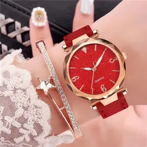 Close-up of starry red quartz watch with rose gold case and matching star bracelet