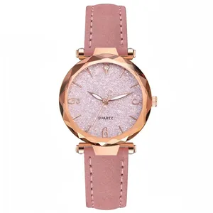 Close-up of pink glitter watch dial with rose gold case and quartz movement detail