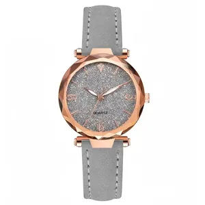 Macro detail of women quartz watch with rose gold case and faceted glass crystal
