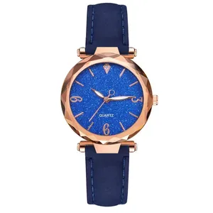 Detailed view of women's quartz watch with dark blue starry dial and faceted rose gold case