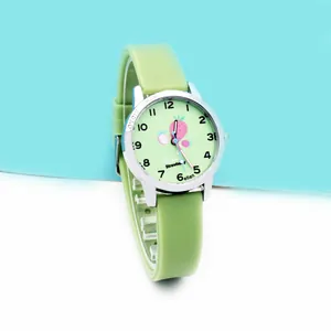 Macro view of light green silicone kids watch with strawberry illustration on the dial