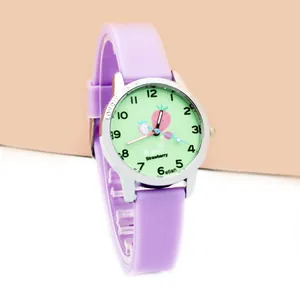 Detail view of purple silicone kids watch with green strawberry dial and clear numbers