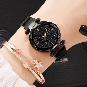 Detail of starry sky watch with mesh band and rose gold zircon bracelet on wrist