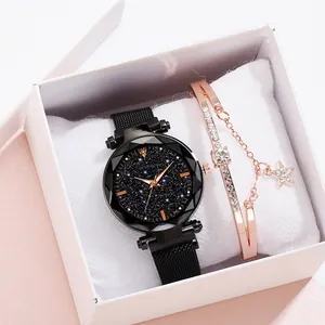 Detail of starry sky watch with magnetic band and matching star bracelet in gift box