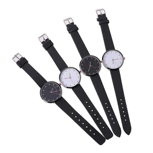 Minimalist quartz wristwatches with black leather bands and rose gold heart dial details