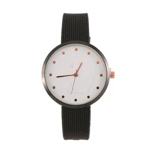 Minimalist black strap watch with white dial featuring a 3D embossed heart and rose gold accents