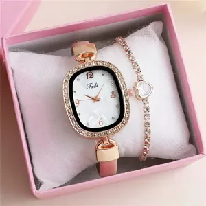Pink leather watch with marble rhinestones and a matching heart charm bracelet in a box