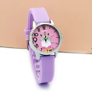 Macro shot of children's purple silicone watch featuring a cute cartoon alpaca dial