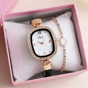 Women's rose gold diamond watch with dark green leather strap and heart bracelet set