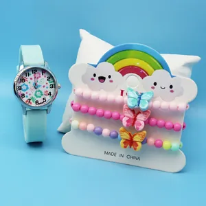 Close-up of kids quartz watch with floral dial and colorful beaded butterfly bracelets