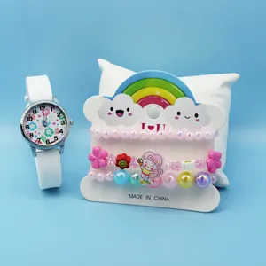 Close-up of children cartoon watch set with mermaid charms and beaded bracelets on display