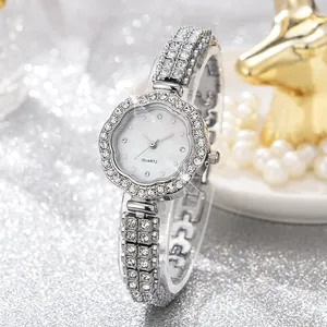 Macro shot of luxury quartz watch with diamond-encrusted bezel and silver wavy case design