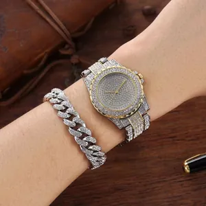 Close-up of luxury women watch and iced-out cuban bracelet set on professional business desk