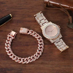 Detailed view of rose gold diamond watch and Cuban link bracelet gift set on wood