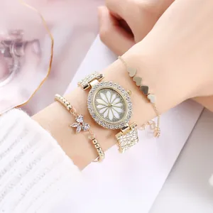 Luxurious gold oval quartz watch with daisy dial and sparkling rhinestone bracelets set