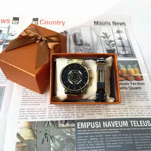 Montre homme dorée et coffret bracelet noir dans un écrin cadeau orange