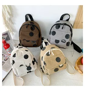 Corduroy mini backpacks with polka dots in brown, gray, cream, and khaki options