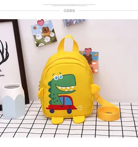 Mochila infantil amarilla de dinosaurio con dibujo animado para niños y niñas