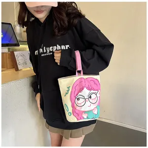 Detail of cute anime girl illustration on cream canvas bucket bag with pink handles