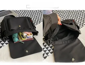 Detail view of messenger bag interior showing multi-compartment storage for daily items
