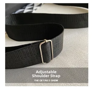 Close-up of durable black nylon adjustable shoulder strap with silver metal buckle