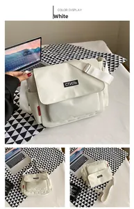 Detailed view of white canvas messenger bag featuring Russian text patch and wide strap