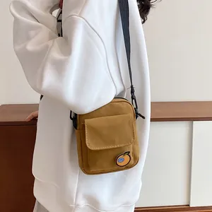 Japanese style canvas crossbody bag in ginger yellow with cute orange patch detail