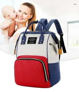 Macro shot of tricolor diaper bag featuring durable fabric and multi-pocket internal structure