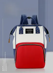 Detail of red white and blue multifunctional mommy backpack with spacious pockets