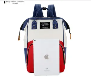 Size comparison between the color-block mommy backpack and an iPad for scale
