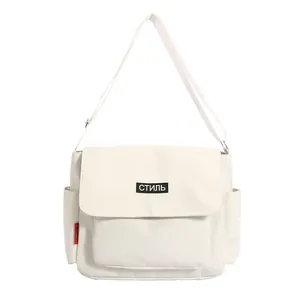 Minimalist beige messenger bag with adjustable strap and stylish front flap design
