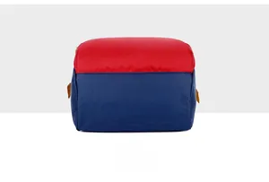 Detailed bottom view of large capacity diaper bag showing red and blue canvas stitching