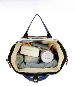 Internal layout of diaper bag showing large capacity with functional storage compartments