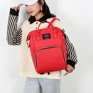 Large red multifunctional diaper backpack with double top handles and U-shaped zipper pocket