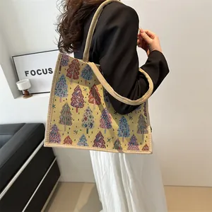 Linen tote bag with colorful Christmas tree jacquard patterns and woven rope handles