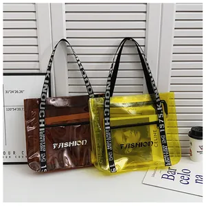 Detail of transparent PVC tote bags with Fashion letter print and colorful webbing straps