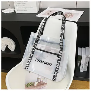 Detailed shot of transparent PVC tote bag with stylish black and white fabric shoulder strap