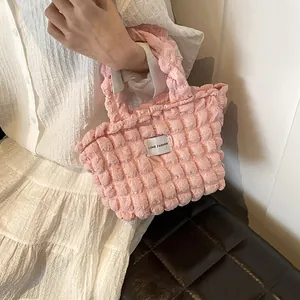 Pink popcorn textured shoulder bag for women with a black and white Love Fashion patch