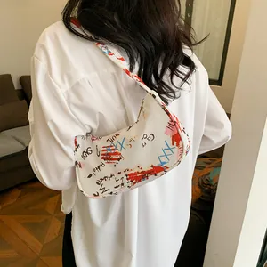 Graffiti style white shoulder bag for women featuring colorful artistic letter patterns