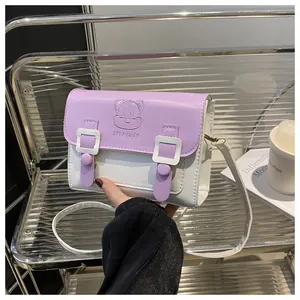 Detail of lavender and ivory PU leather crossbody bag with cartoon relief pattern