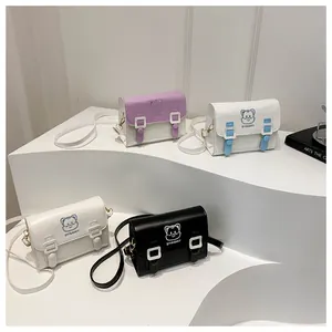 Close-up of small PU leather cartoon satchels with cat patterns and buckle detail